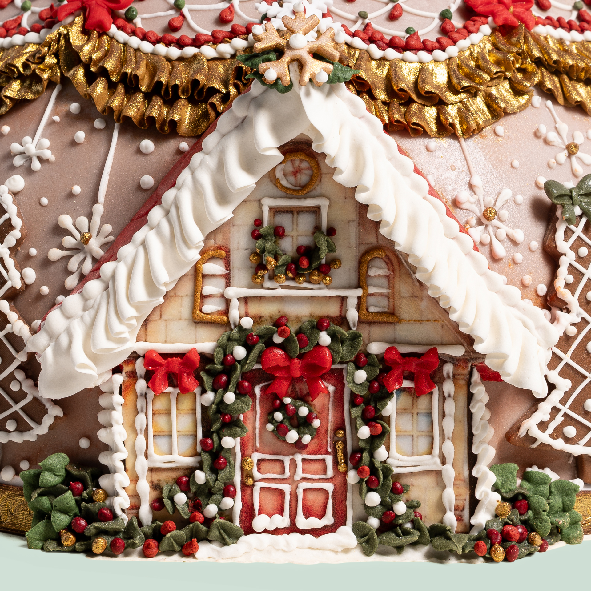 Hand-decorated Panettone with snow-covered house